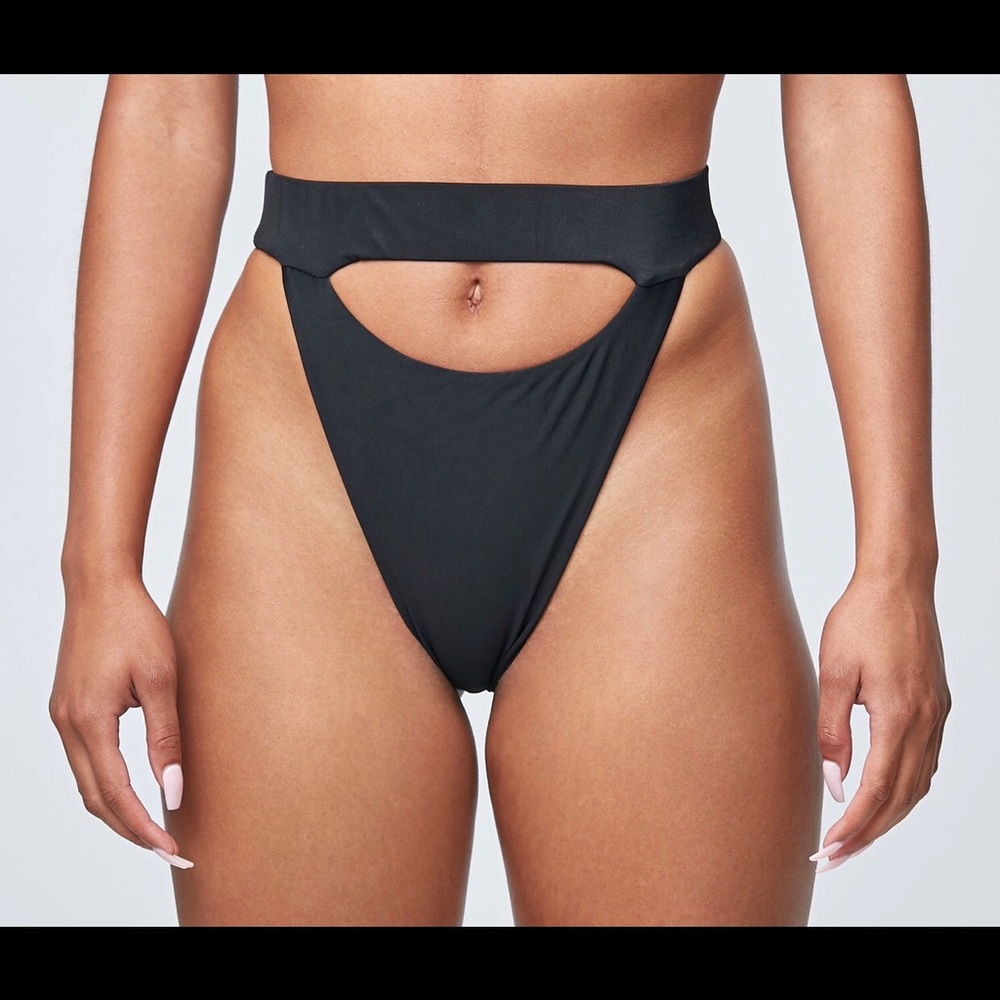 Black cut out bathing suit bottoms.